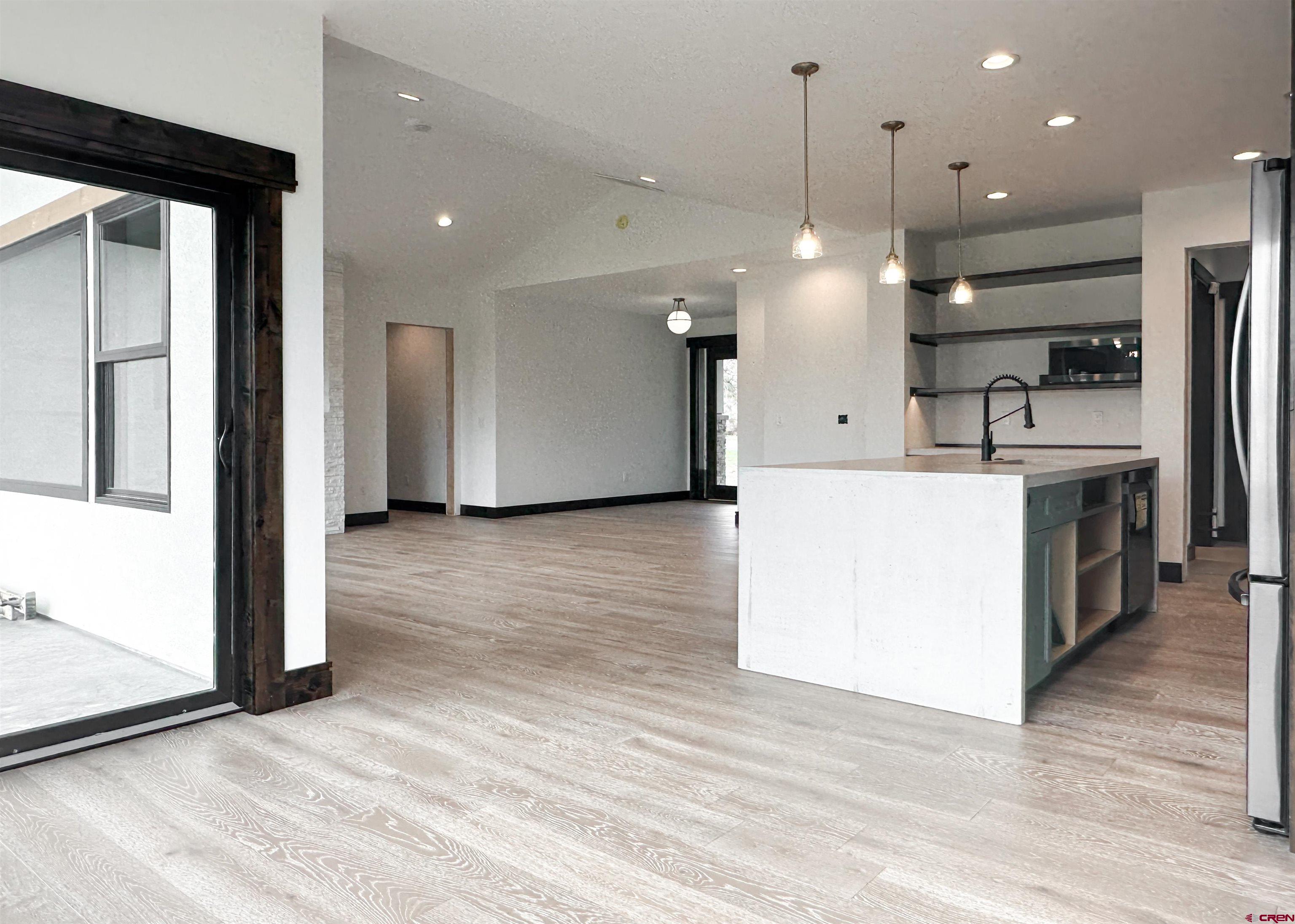 820 Southeast Pine Street Cedaredge, CO 81413 - Photo 16 of 35 a view of a kitchen with a refrigerator a sink and a stove top oven