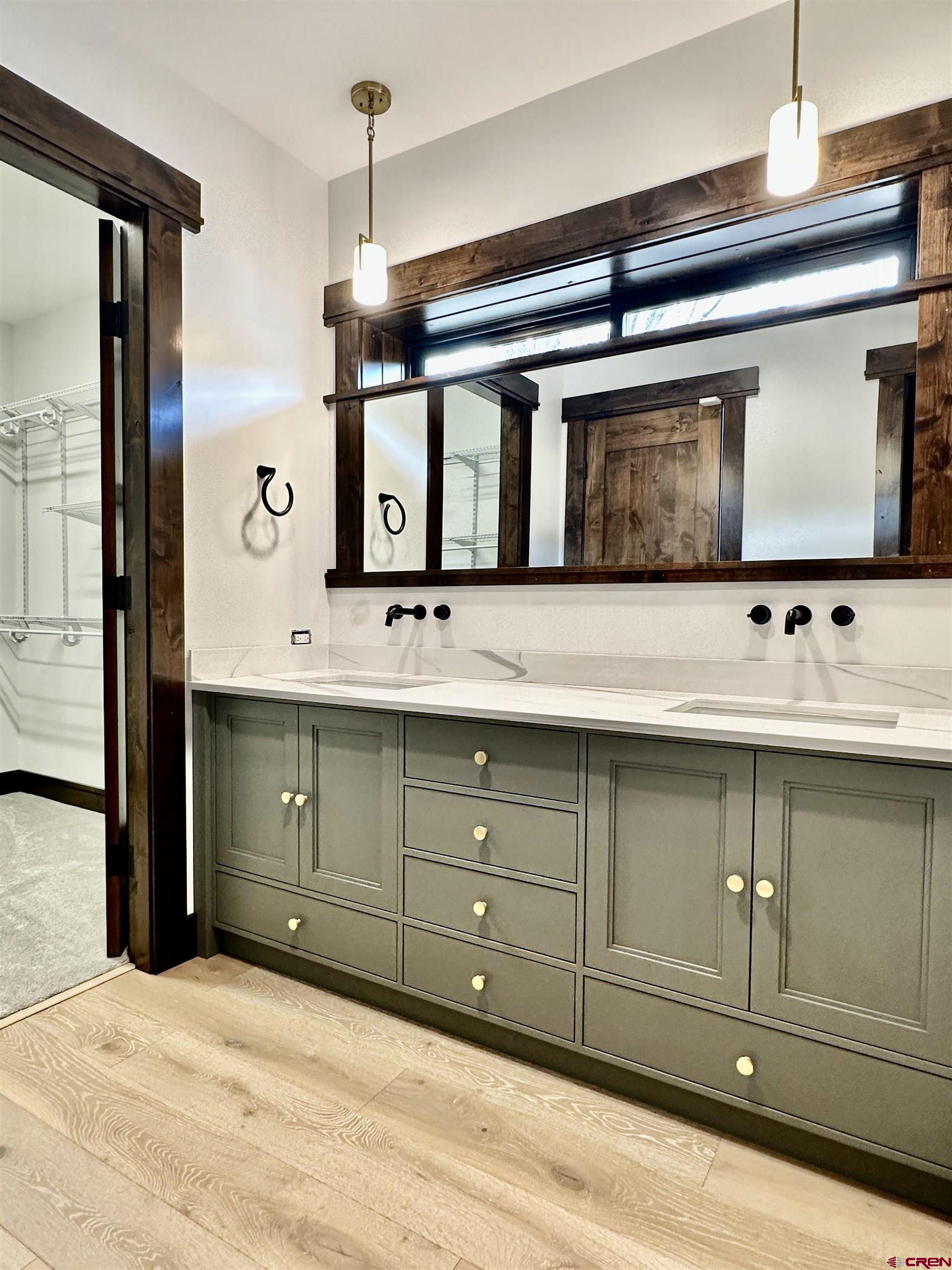 820 Southeast Pine Street Cedaredge, CO 81413 - Photo 20 of 35 a bathroom with a sink vanity and mirror