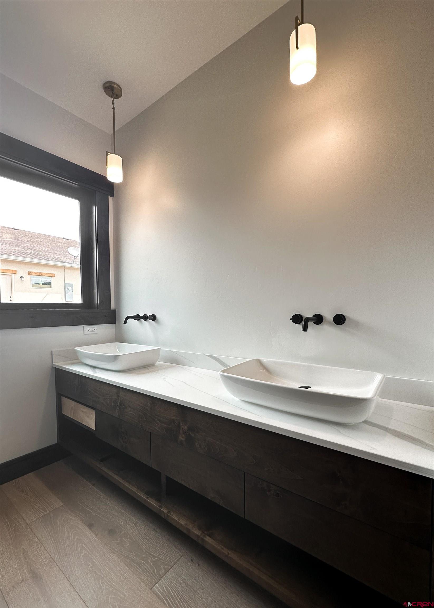 820 Southeast Pine Street Cedaredge, CO 81413 - Photo 24 of 35 a bathroom with a sink and a mirror