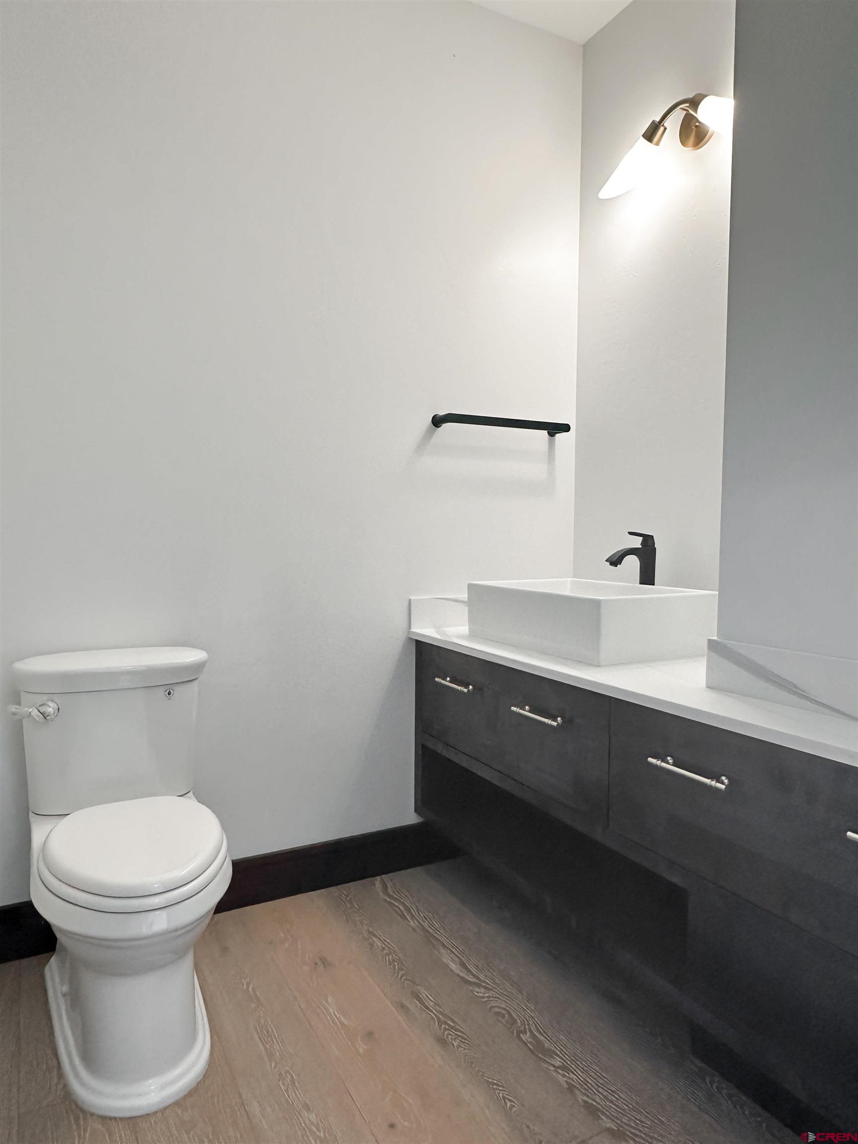 820 Southeast Pine Street Cedaredge, CO 81413 - Photo 29 of 35 a bathroom with a sink and a toilet