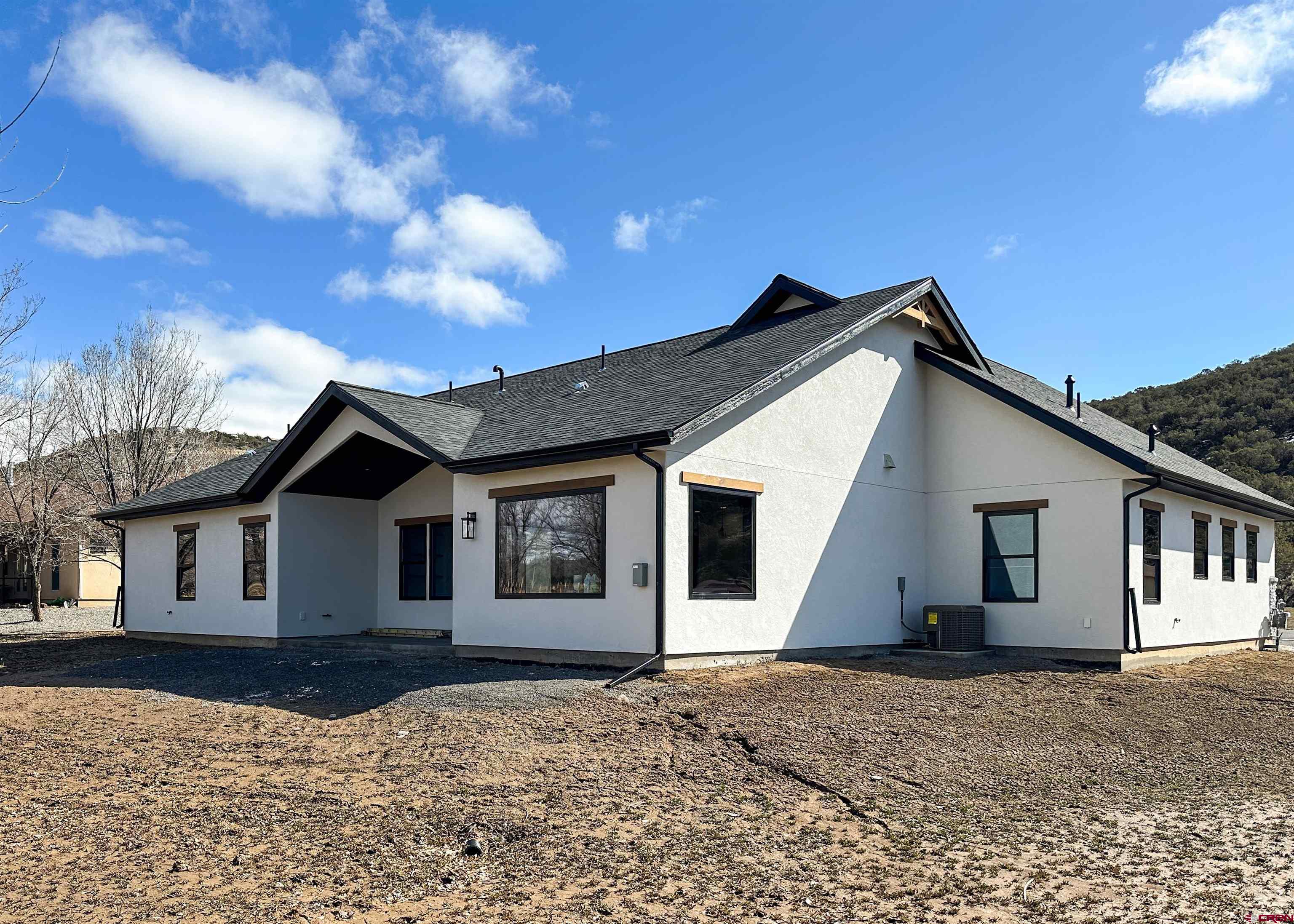 820 Southeast Pine Street Cedaredge, CO 81413 - Photo 33 of 35 a view of house with yard and sitting area