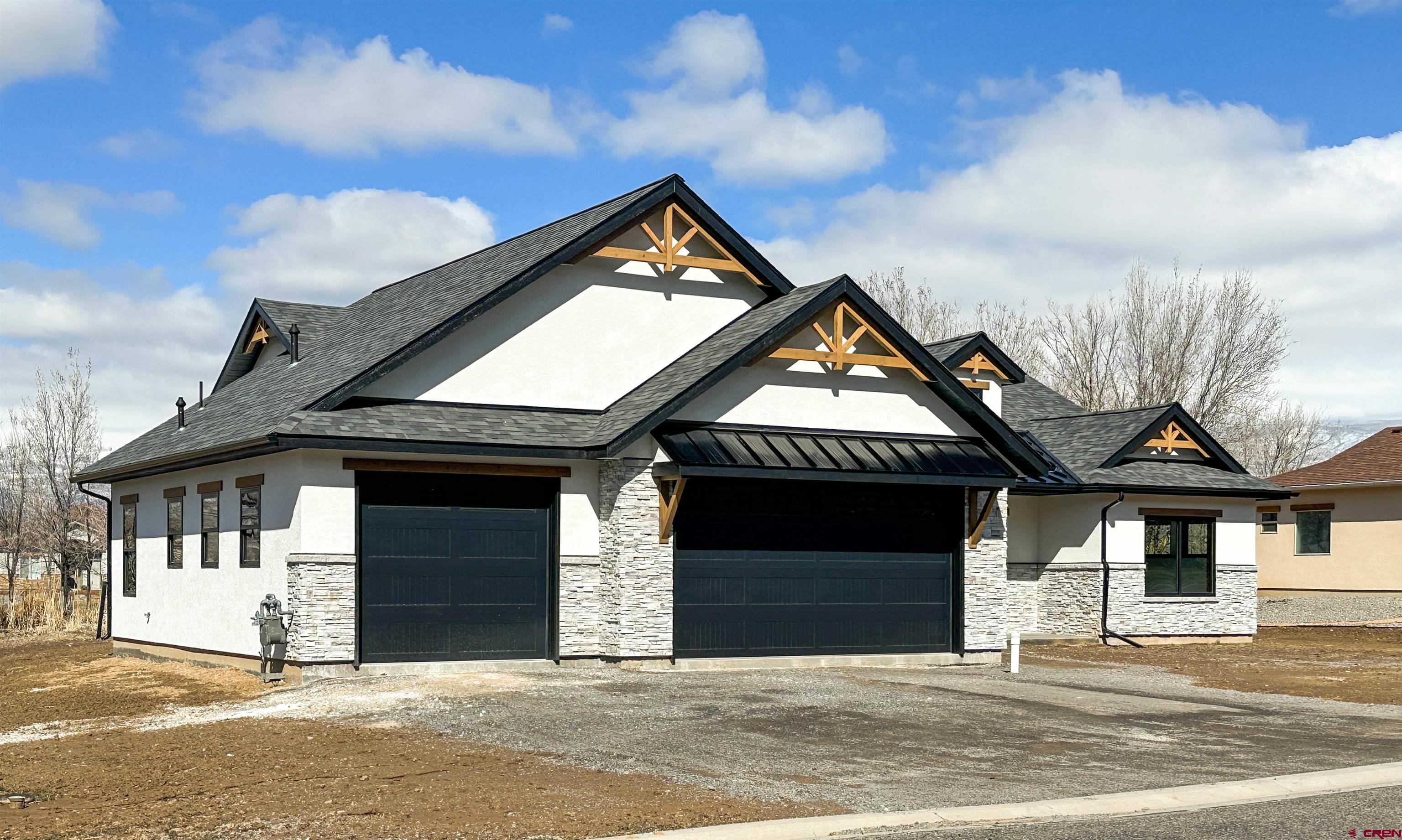 820 Southeast Pine Street Cedaredge, CO 81413 - Photo 4 of 35 a view of a house with a outdoor space and garage
