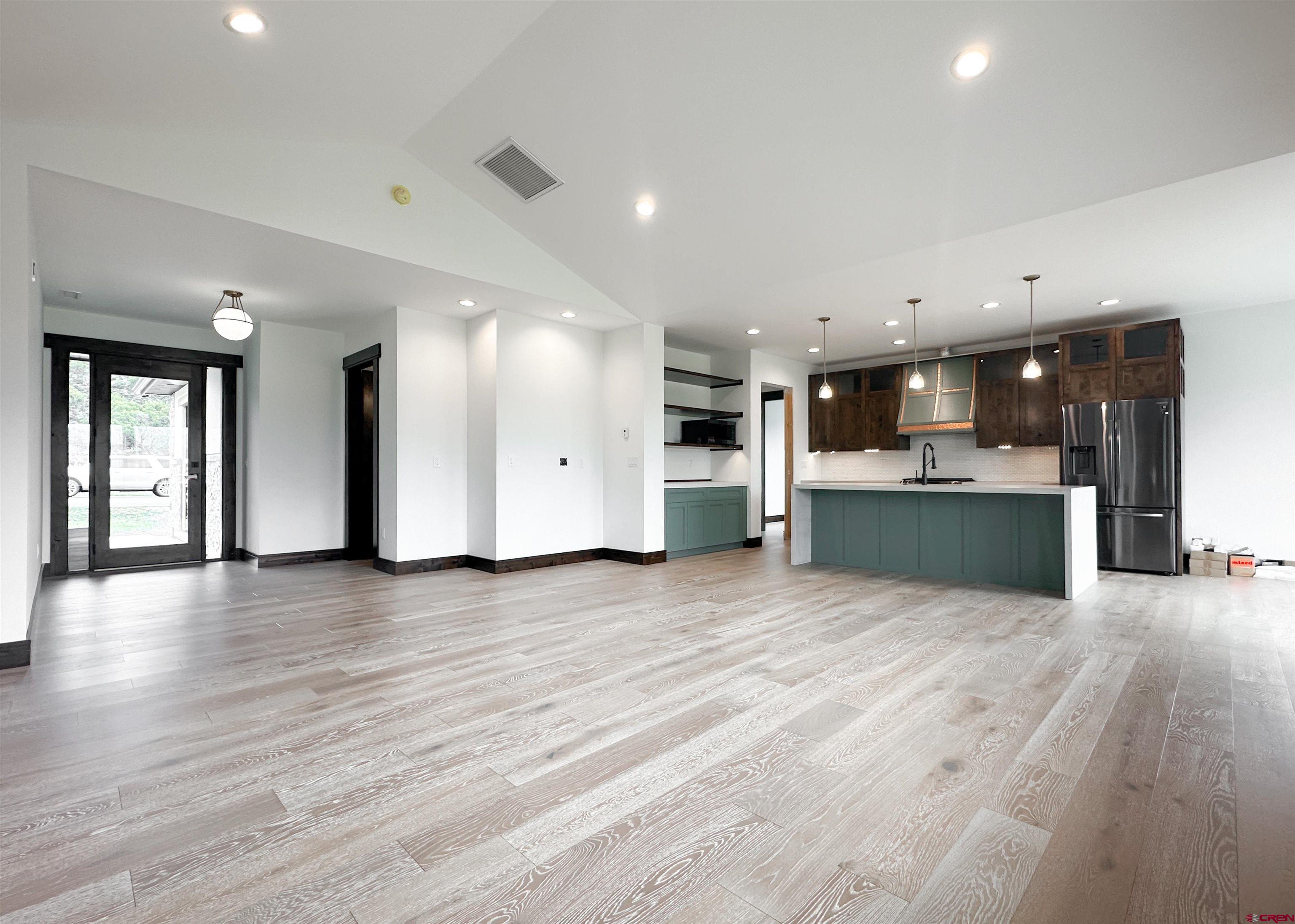 820 Southeast Pine Street Cedaredge, CO 81413 - Photo 6 of 35 a view of kitchen with kitchen island wooden floor center island and appliances