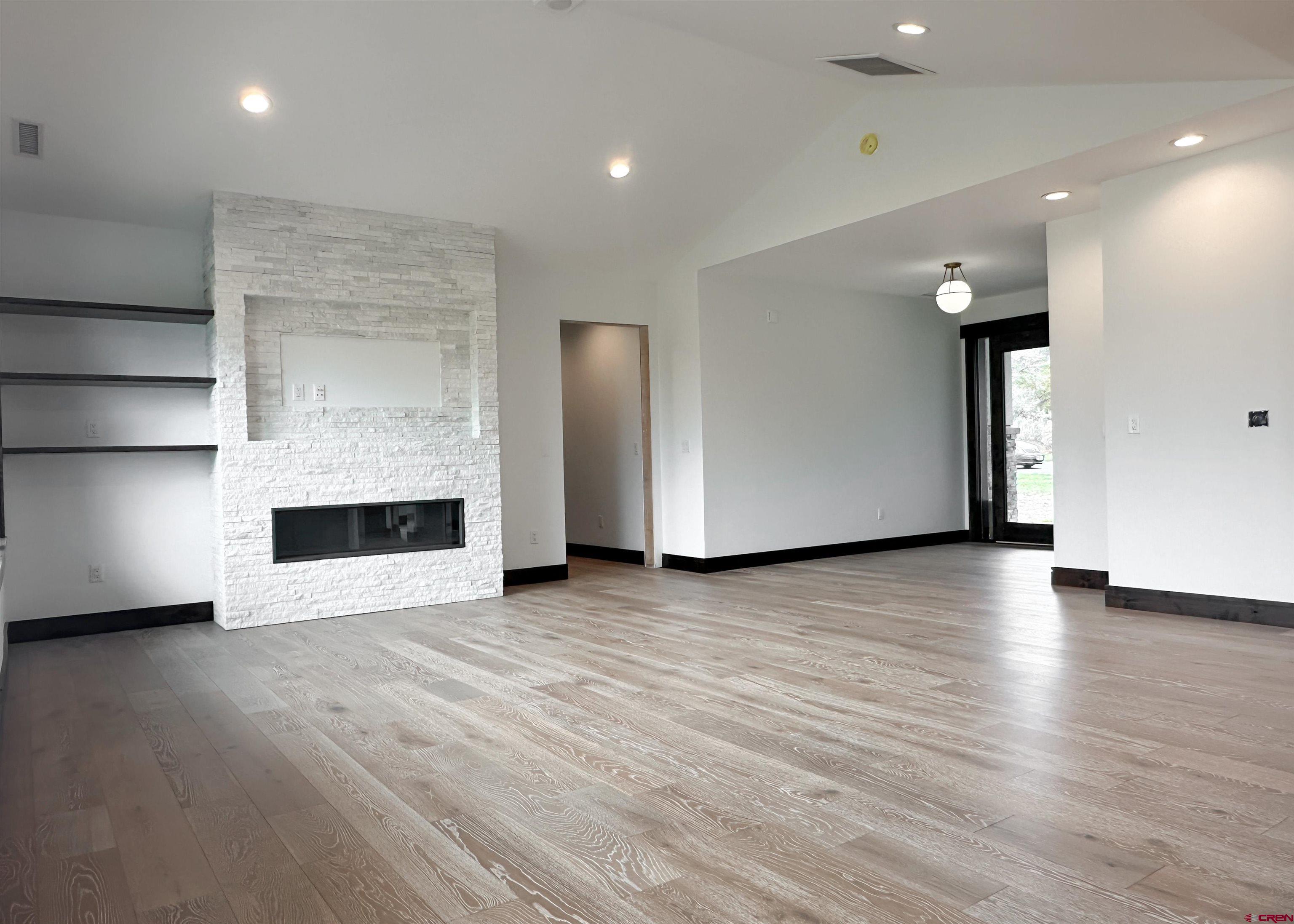820 Southeast Pine Street Cedaredge, CO 81413 - Photo 9 of 35 a view of a water heater room with a hallway