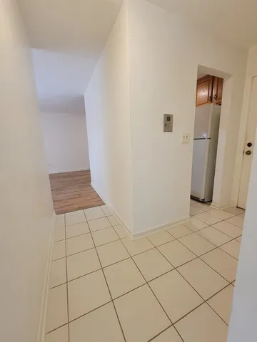 a view of a livingroom with an empty space and a sink