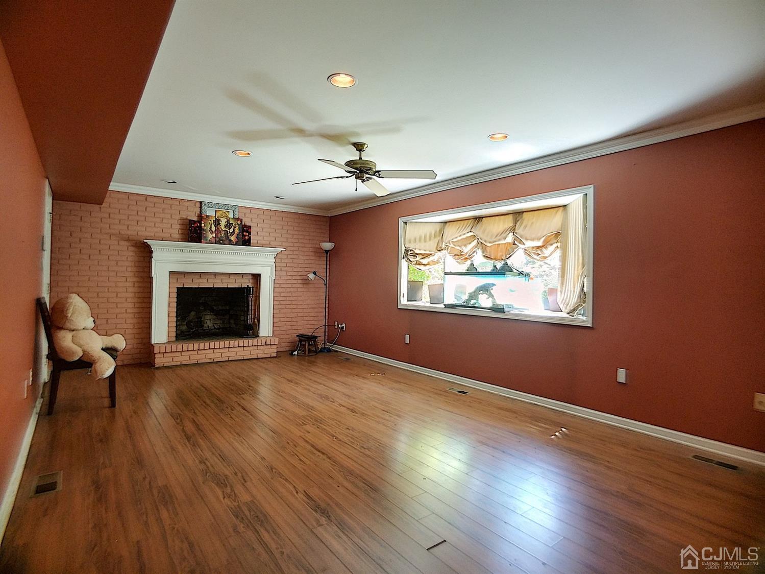26 Fairfield Road Princeton, NJ 08540 - Photo 3 of 26 an empty room with windows fireplace and wooden floor
