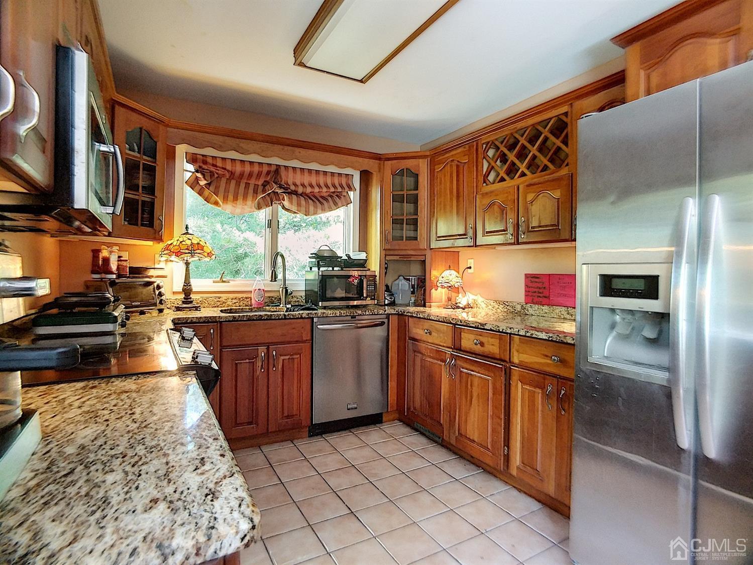 26 Fairfield Road Princeton, NJ 08540 - Photo 7 of 26 a kitchen with stainless steel appliances granite countertop sink stove and refrigerator