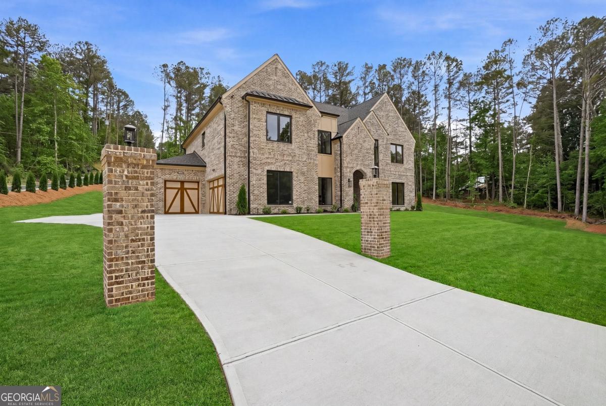 1557 Whitley Road Dacula, GA 30019 - Photo 2 of 46 a front view of a house with garden