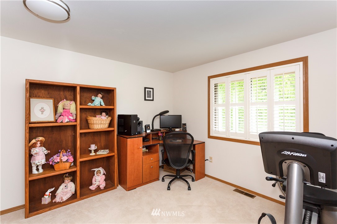 3205 211th Street Southeast Bothell, WA 98021 - Photo 22 of 40 a view of a workspace with furniture and a window