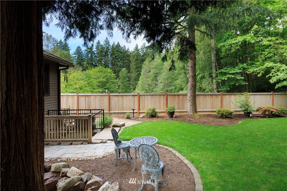 3205 211th Street Southeast Bothell, WA 98021 - Photo 40 of 40 a view of a backyard with table and chairs and potted plants