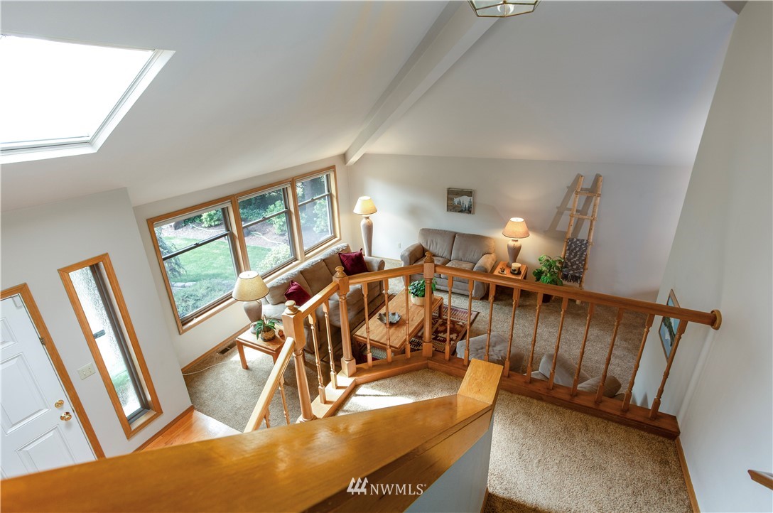 3205 211th Street Southeast Bothell, WA 98021 - Photo 5 of 40 a view of a livingroom with furniture and a floor to ceiling window