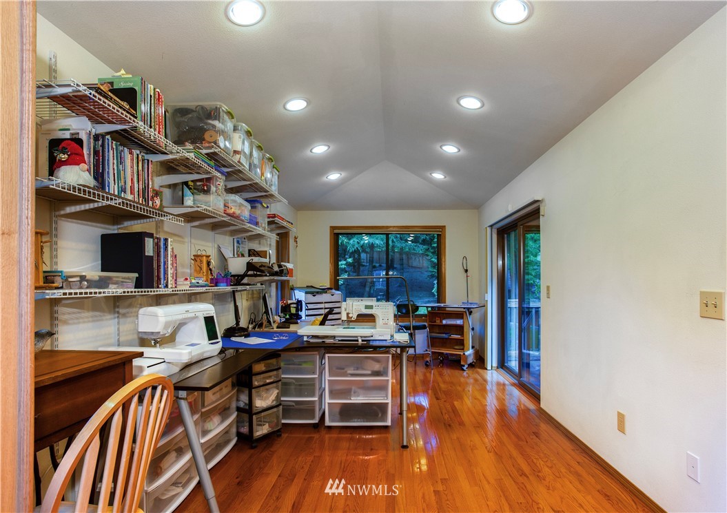 3205 211th Street Southeast Bothell, WA 98021 - Photo 9 of 40 a view of a workspace with furniture and toys