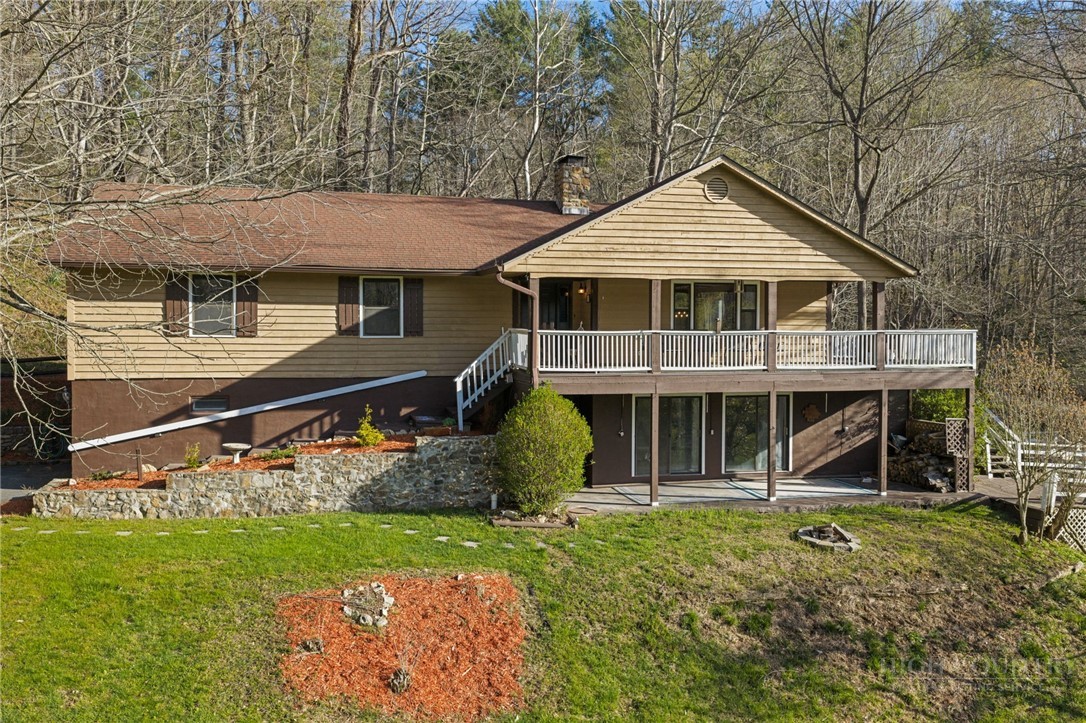 2345 Watauga River Road Sugar Grove, NC 28679 - Photo 44 of 50 a front view of a house with a yard
