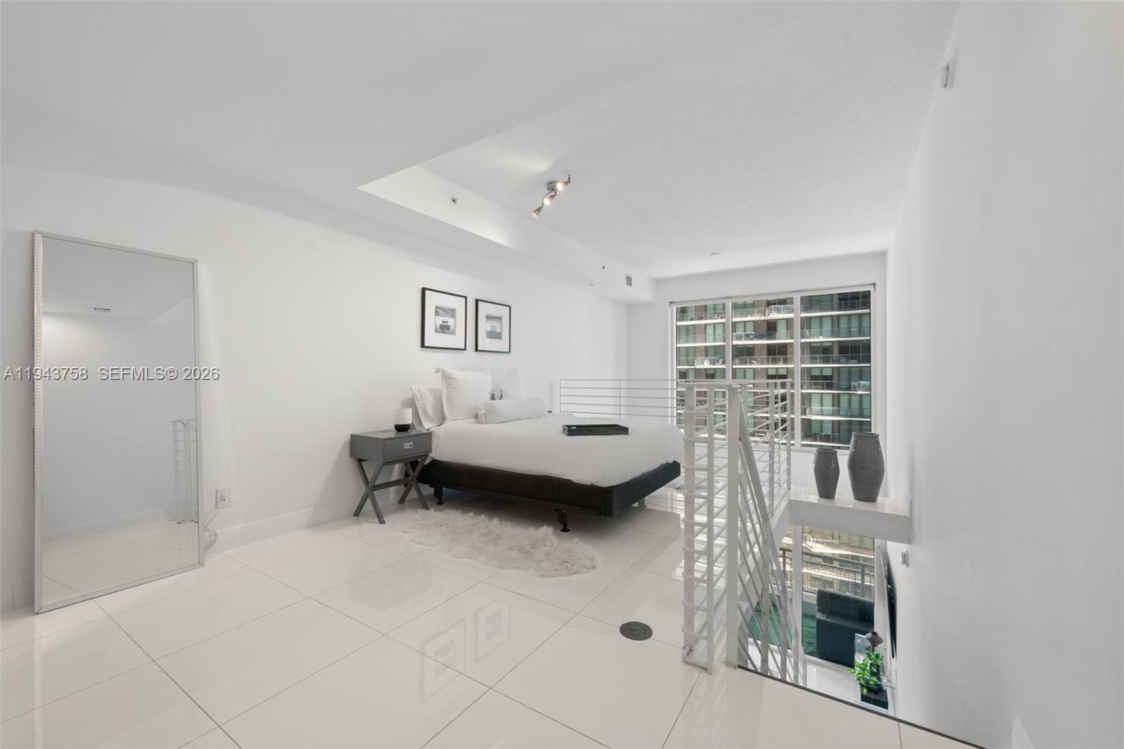 60 Southwest 13th Street, Unit 2812 Miami, FL 33130 - Photo 20 of 66 a living room with furniture and a fireplace