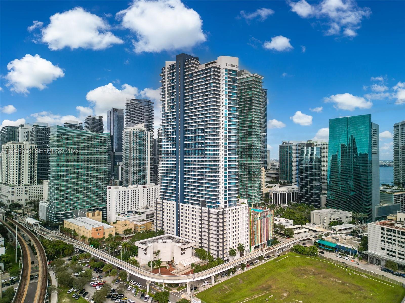 60 Southwest 13th Street, Unit 2812 Miami, FL 33130 - Photo 2 of 66 a view of a patio with couches table and chairs and potted plants