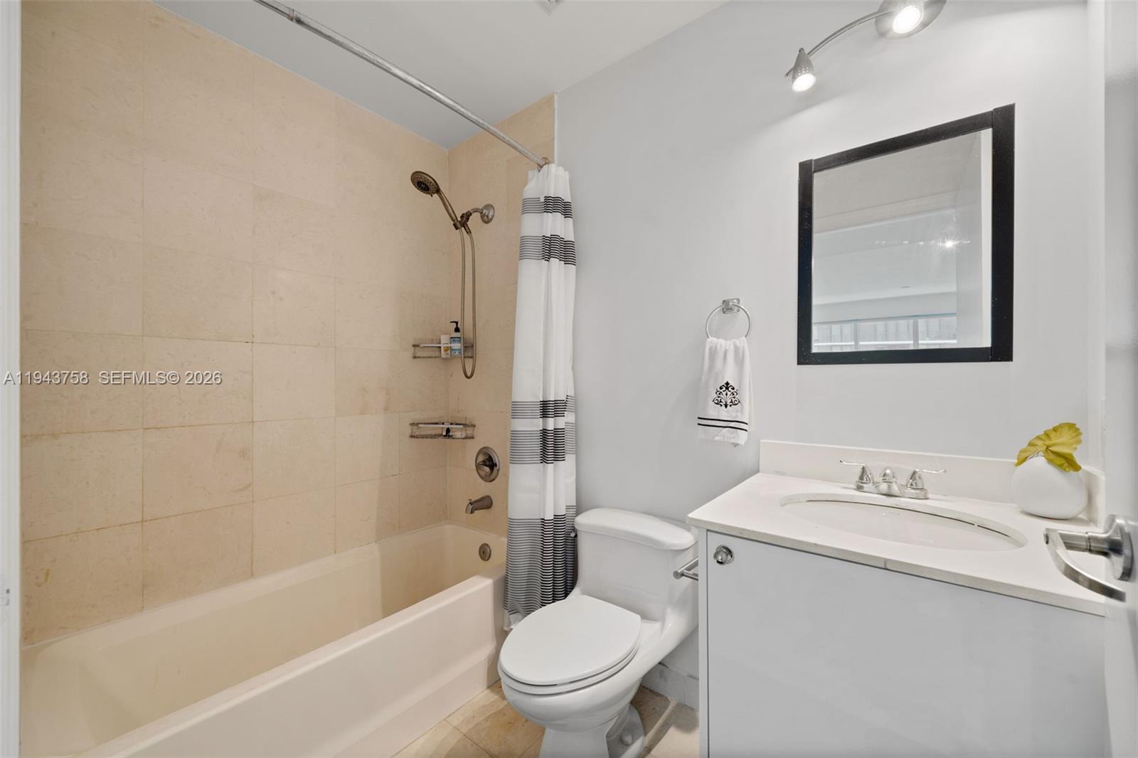 60 Southwest 13th Street, Unit 2812 Miami, FL 33130 - Photo 25 of 66 a bathroom with a sink toilet and shower