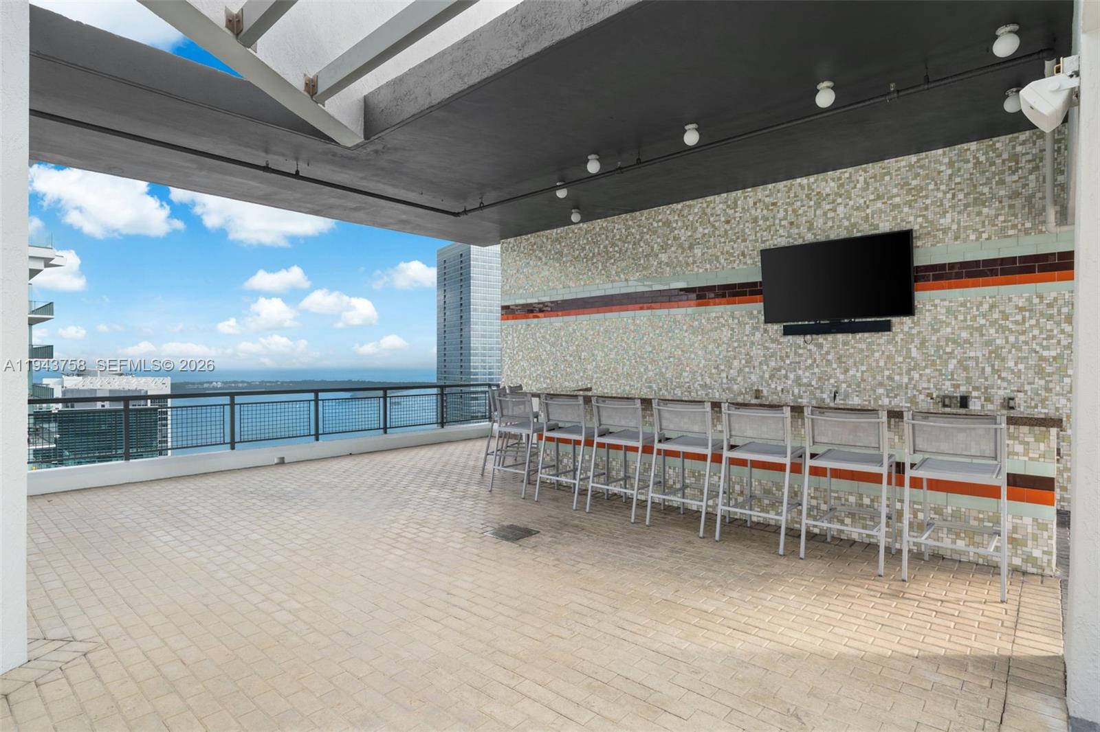 60 Southwest 13th Street, Unit 2812 Miami, FL 33130 - Photo 31 of 66 a room with furniture and a flat screen tv