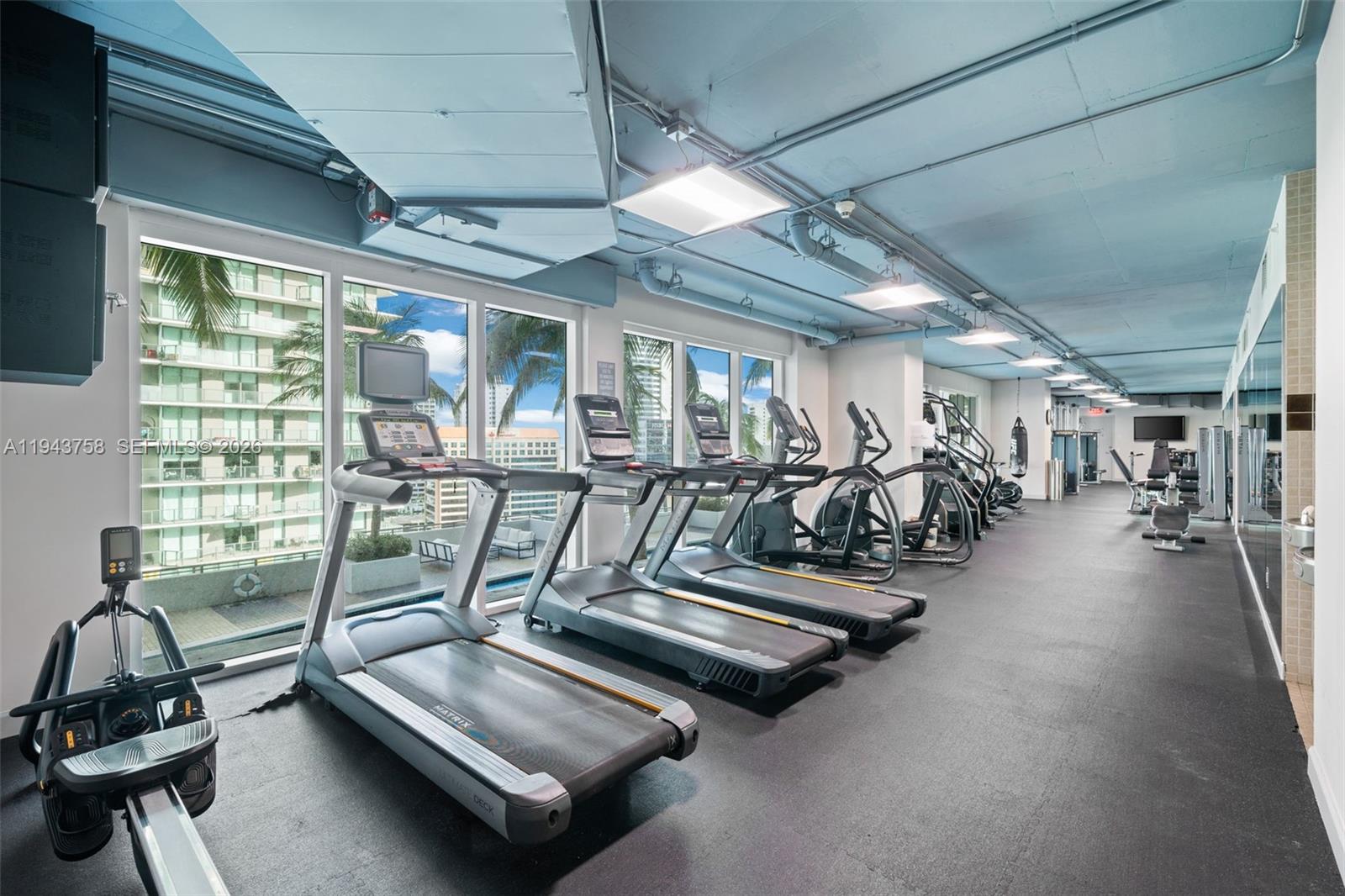 60 Southwest 13th Street, Unit 2812 Miami, FL 33130 - Photo 34 of 66 a view of a room with gym equipment