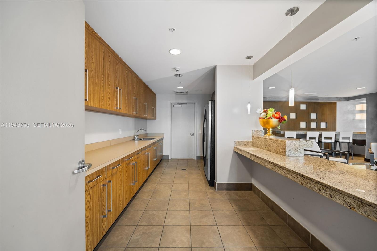 60 Southwest 13th Street, Unit 2812 Miami, FL 33130 - Photo 44 of 66 a large bathroom with a granite countertop double vanity sink a mirror and a bathtub