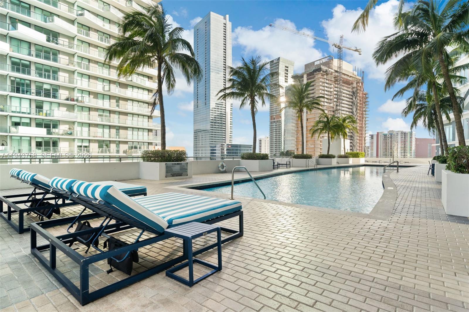 60 Southwest 13th Street, Unit 2812 Miami, FL 33130 - Photo 47 of 66 a view of swimming pool with outdoor seating