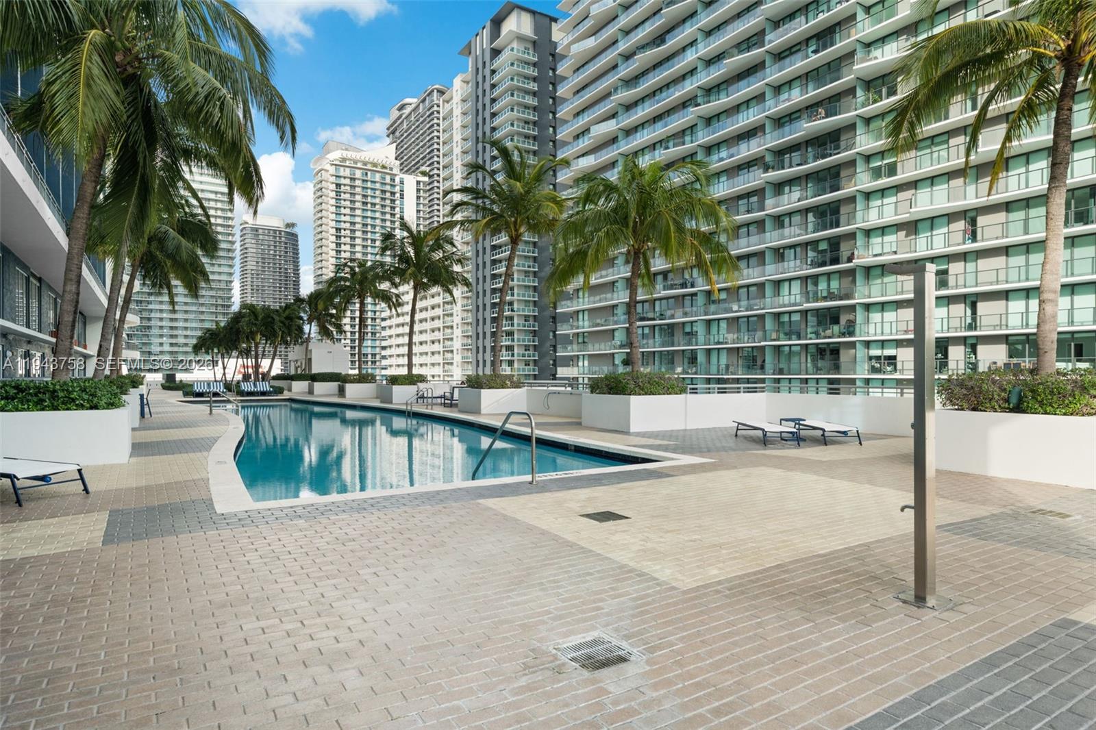 60 Southwest 13th Street, Unit 2812 Miami, FL 33130 - Photo 51 of 66 a view of a swimming pool with a patio