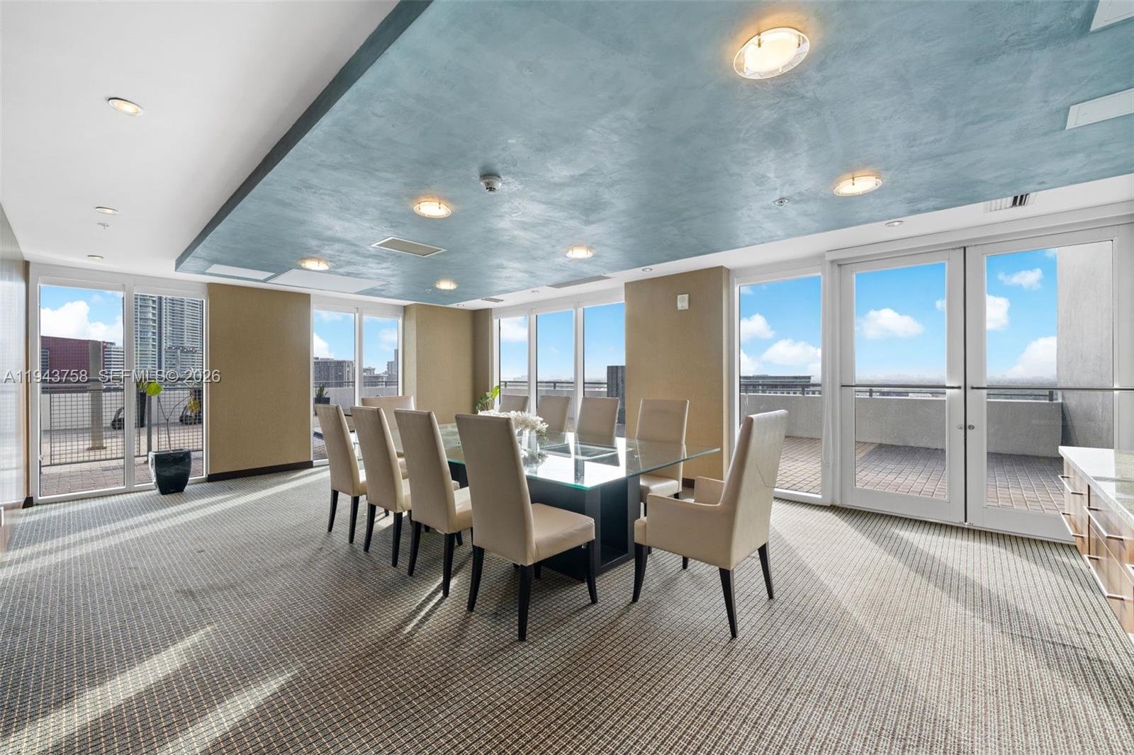 60 Southwest 13th Street, Unit 2812 Miami, FL 33130 - Photo 53 of 66 a dining room with furniture and a floor to ceiling window