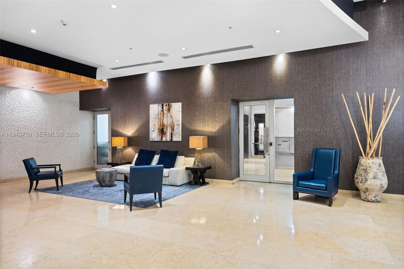 60 Southwest 13th Street, Unit 2812 Miami, FL 33130 - Photo 56 of 66 a living room with furniture and a flat screen tv