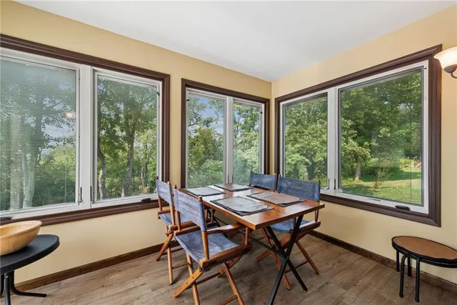 a living room filled with furniture and a window