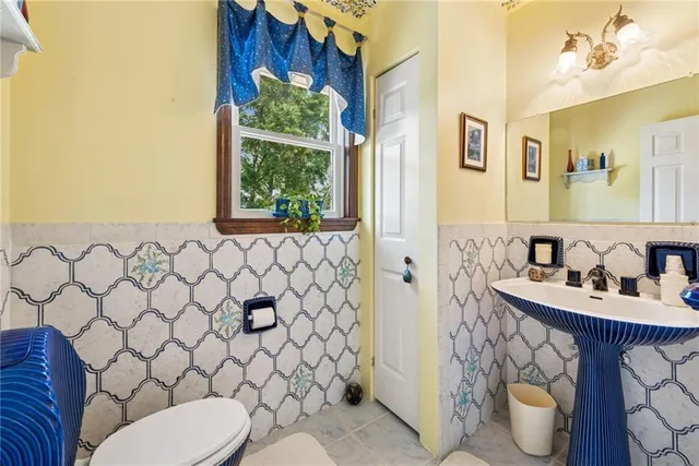 a bed room with bed and a chandelier