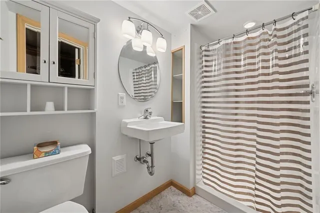 a view of a room with wooden walls