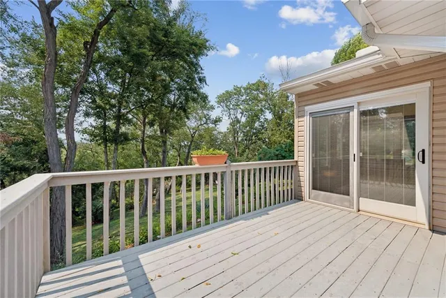 a view of a patio with table and chairs near a yard
