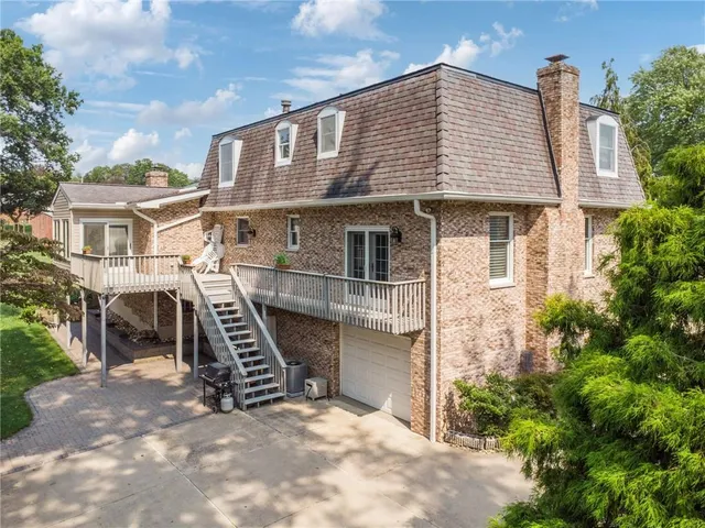 a front view of a house with stairs