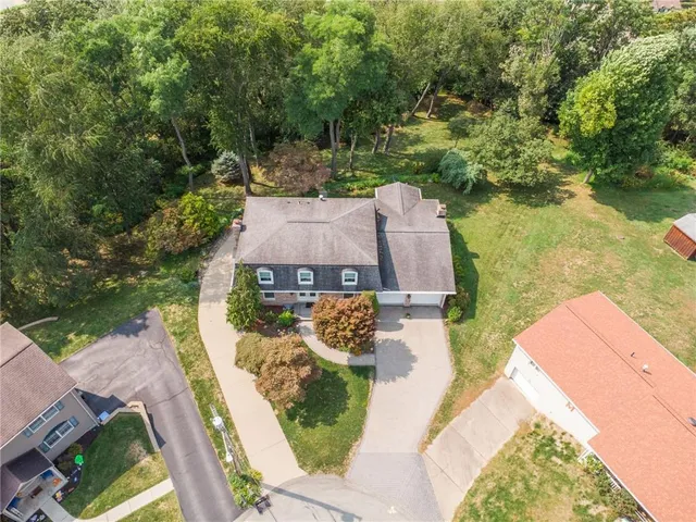 an aerial view of a house with outdoor space