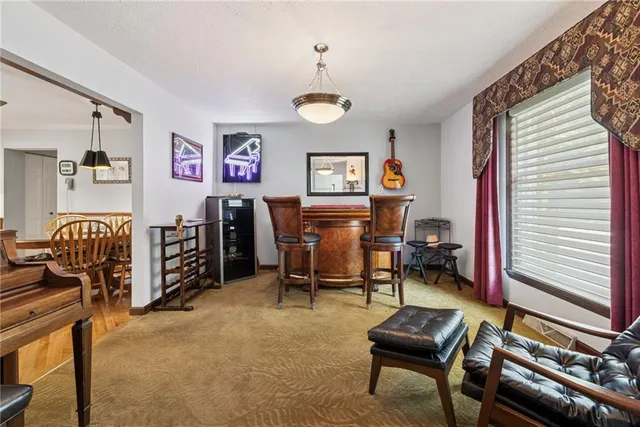 a bedroom with furniture and a window
