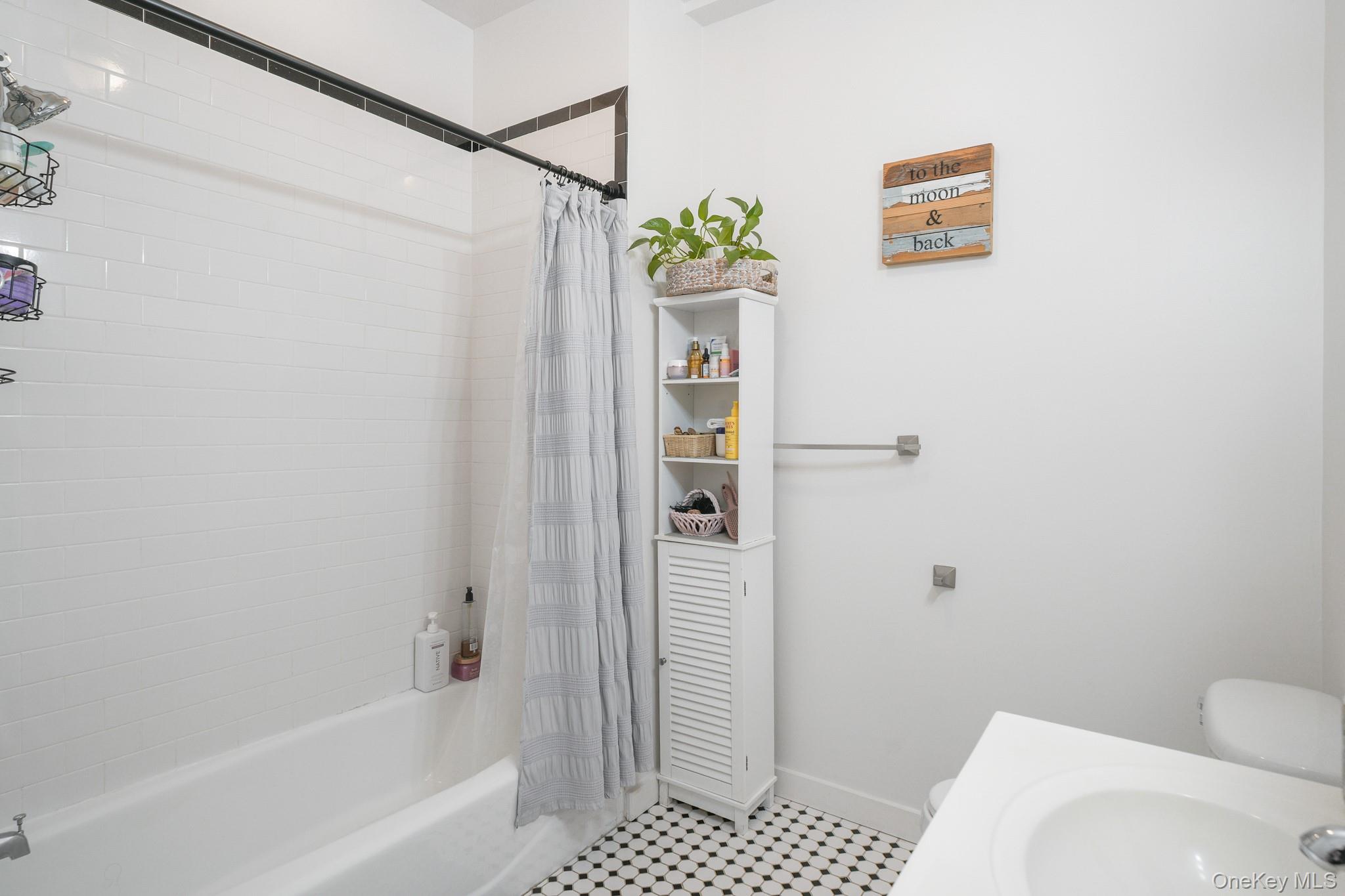 135 Main Street, Unit 302 Ossining, NY 10562 - Photo 13 of 16 a bathroom with a shower and a toilet