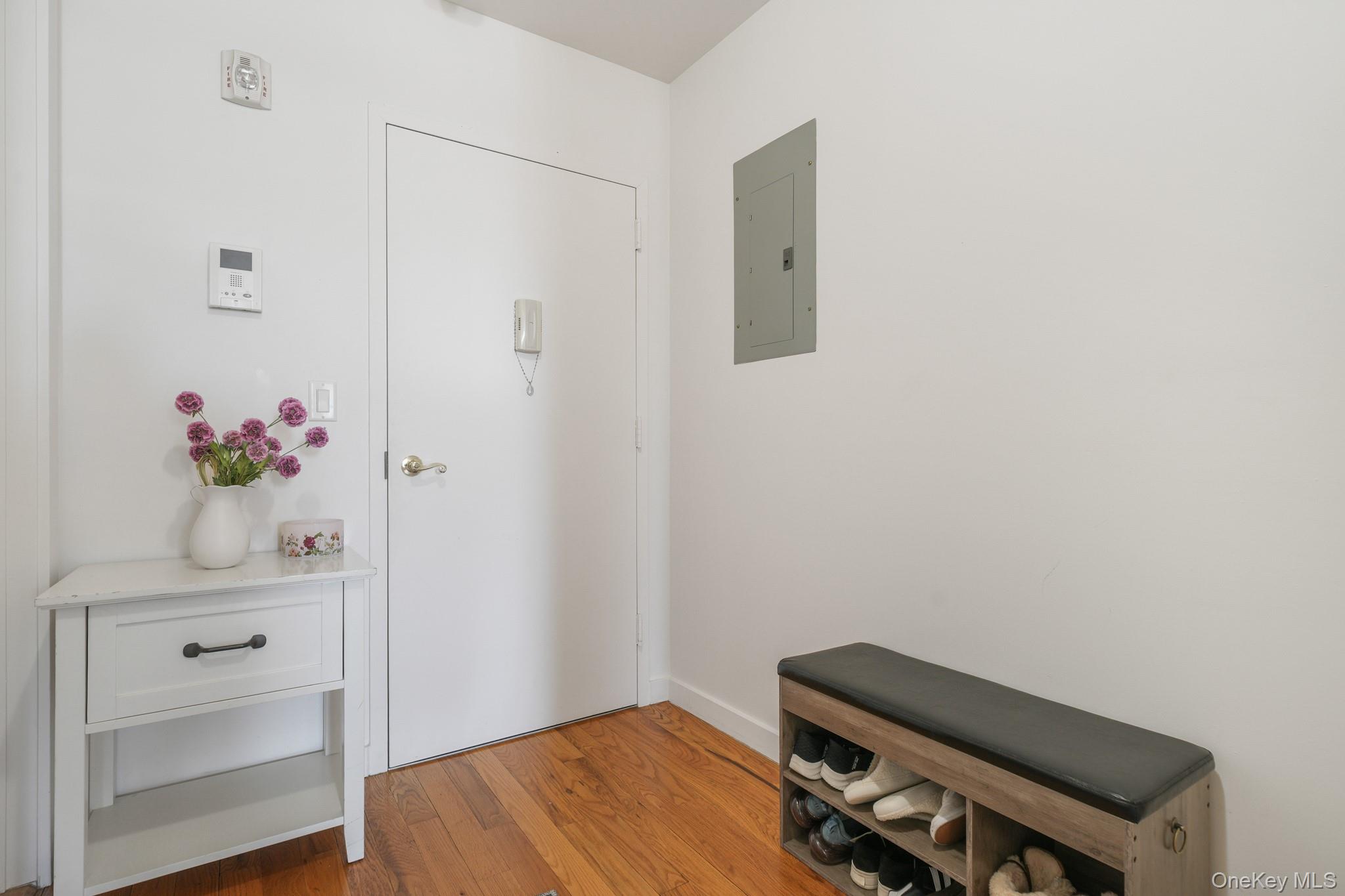 135 Main Street, Unit 302 Ossining, NY 10562 - Photo 14 of 16 a room with a closet and wooden floor