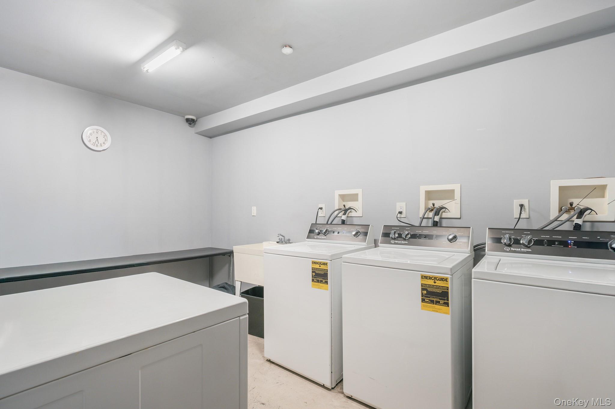 135 Main Street, Unit 302 Ossining, NY 10562 - Photo 15 of 16 a utility room with dryer and washer