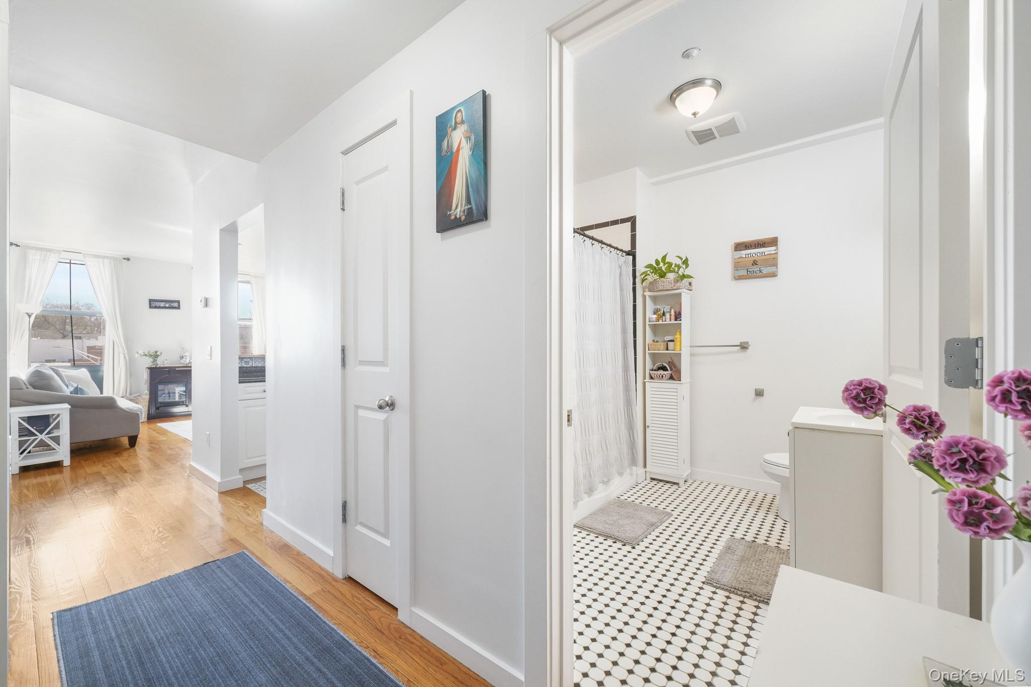 135 Main Street, Unit 302 Ossining, NY 10562 - Photo 3 of 16 a living room with furniture and wooden floor