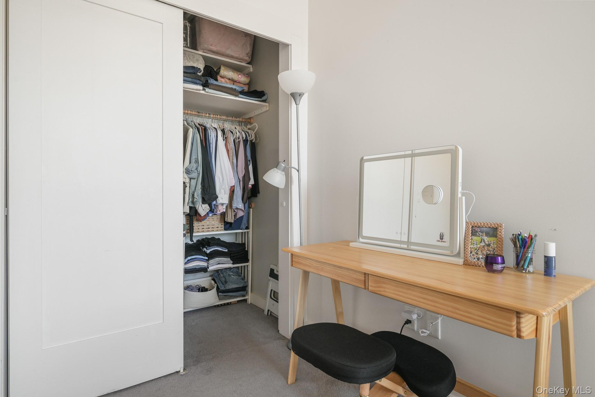 135 Main Street, Unit 302 Ossining, NY 10562 - Photo 10 of 16 a view of walk in closet with clothes and shoes