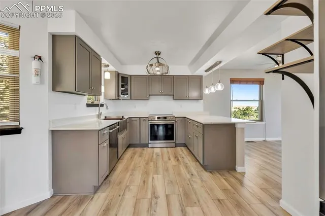 a kitchen with cabinets and window
