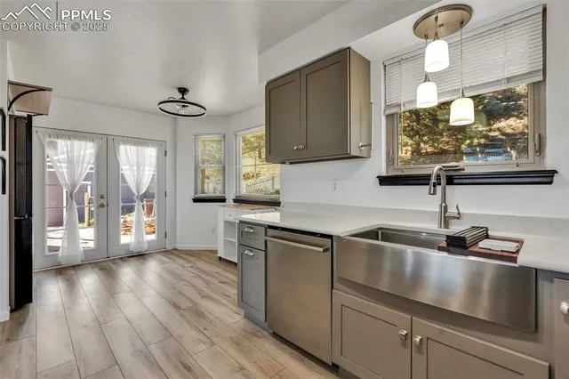 a view of an entryway with wooden floor and windows