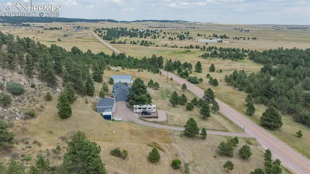an aerial view of residential houses with outdoor space