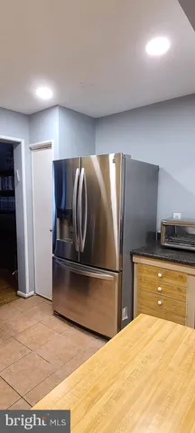 a kitchen with stainless steel appliances wooden cabinets and granite counter tops