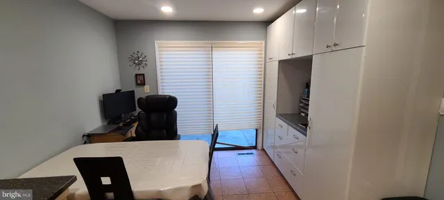a view of kitchen with furniture and wooden floor