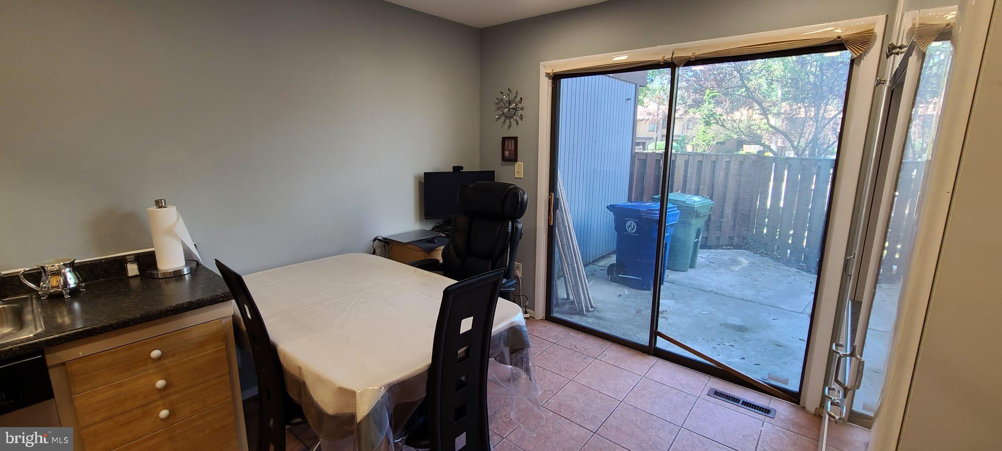 2821 Baneberry Court Baltimore, MD 21209 - Photo 19 of 31 a view of a workspace with furniture and a window