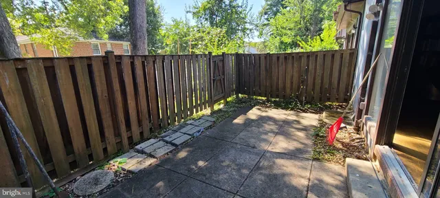 a view of outdoor space with wooden fence