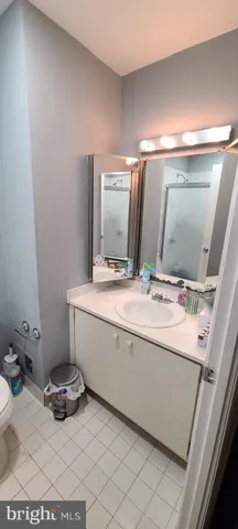 a bathroom with a sink and mirror