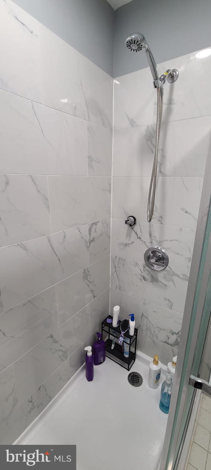 2821 Baneberry Court Baltimore, MD 21209 - Photo 31 of 31 a bathroom with a sink and a shower