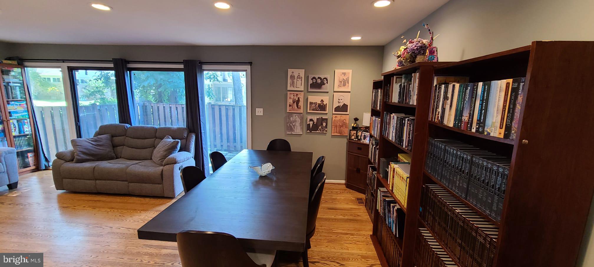 2821 Baneberry Court Baltimore, MD 21209 - Photo 9 of 31 a living room with furniture a large window and wooden floor