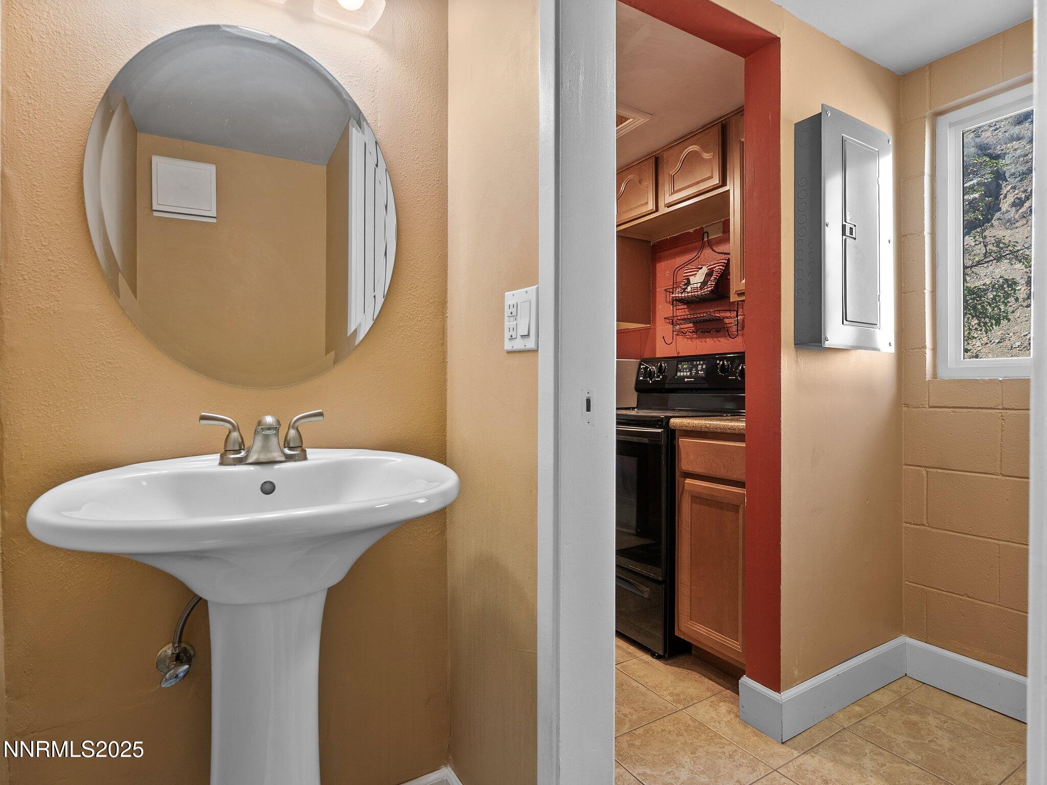 230 Bisset Court, Unit B Reno, NV 89503 - Photo 11 of 14 a bathroom with a sink and a mirror